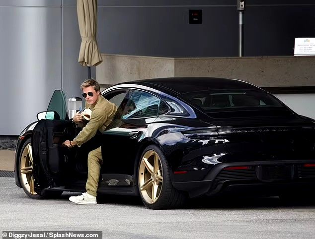 Brad Pitt in his Porsche Taycan