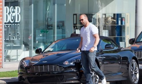 Jason Statham in his Aston Martin DBS Volante